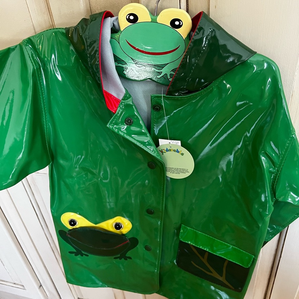 Never used. Adorable raincoat with custom hanger for the child who loves frogs.